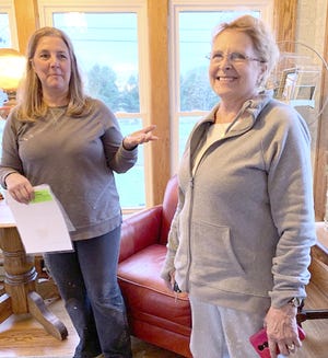 Jill Gunn, executive director of Hope United, and Jill Fulbright, a Sturgis-area interior decorator, discuss work that went into creating Amanda’s House. The Three Rivers home marks its grand opening Tuesday. [Jef Rietsma/Journal]