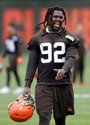 Browns defensive end Chad Thomas walks off the field after an organized team activity session in May. [Tony Dejak/Associated Press]
