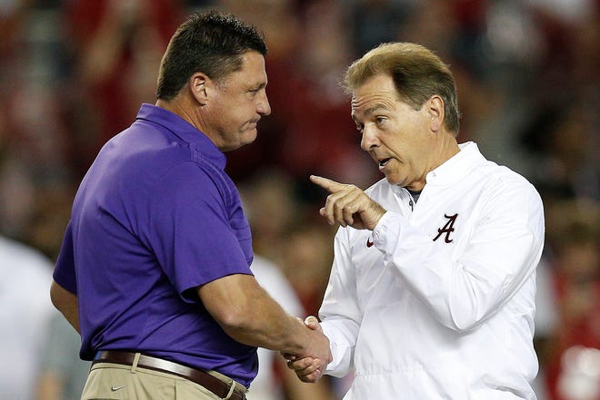 Alabama head coach Nick Saban, right, and LSU head coach Ed Orgeron, left, will meet again on Saturday with the SEC West up for grabs between the two undefeated teams. [FILE/THE ASSOCIATED PRESS]