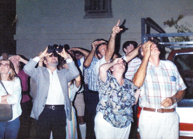 Members of the Mutual UFO Network watch for UFOs over Gulf Breeze in September 1989. [DON WARE/CONTRIBUTED PHOTO]