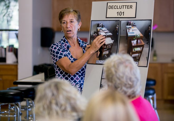 Professional organizer Kathy Andio offers tips on clearing clutter as part of a Declutter 101 class at the Burns Road Community Center in Palm Beach Gardens. Andio formed her business, Let Clutter Go Organizing and Coaching Services, in 2008. [RICHARD GRAULICH/PALMBEACHPOST.COM]