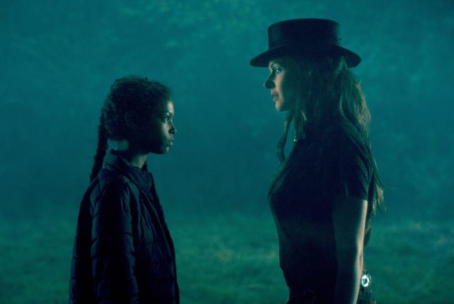 Kyliegh Curran, left, faces off against Rebecca Ferguson in "Doctor Sleep." [Warner Bros. Pictures]