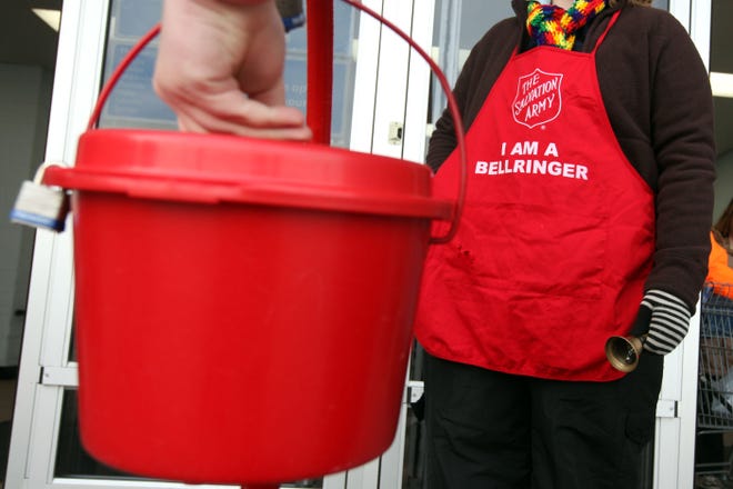Salvation Army Kettel is shown in Burlington. The bell ringers are out collection money for the services provided by the Salvation Army through Chriastmas Eve. [John Lovretta/thehawkeye.com]