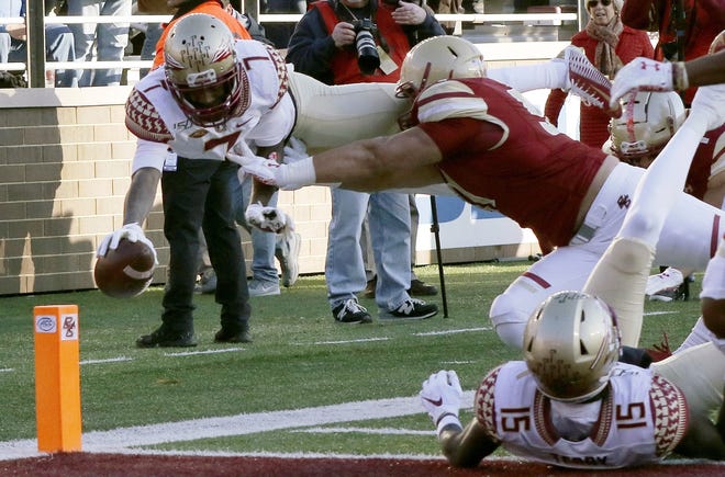 Florida State wide receiver D.J. Matthews dives to the pylon for a touchdown against Boston College on Saturday. [AP Photo/Bill Sikes]