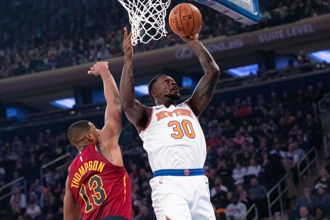 New York Knicks forward Julius Randle (30) goes to the basket past Cleveland Cavaliers center Tristan Thompson (13) during the first half of an NBA basketball game, Sunday, Nov. 10, 2019, at Madison Square Garden in New York. (AP Photo/Mary Altaffer)