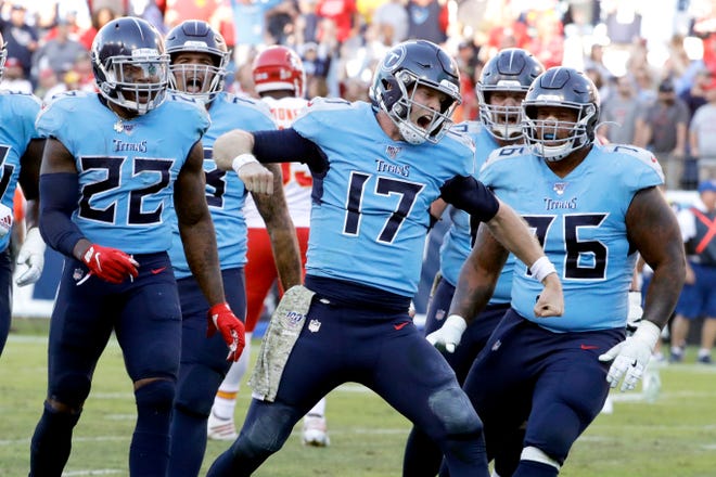 Tennessee Titans quarterback Ryan Tannehill (17) celebrates after scoring a 2-point conversion against the Kansas City Chiefs in the second half of an NFL football game Sunday in Nashville, Tenn. The Titans won 35-32. [AP Photo/James Kenney]