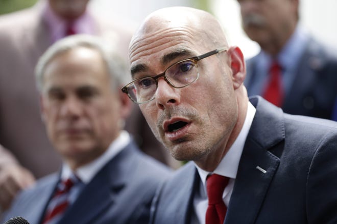 As Dennis Bonnen, shown here in May in Austin with Gov. Greg Abbott, fades away politically, Texas firefighters hope lessons can be learned from the political dumpster fire he created, writes the president of the Texas State Association of Fire Fighters. [AP PHOTO/ERIC GAY/FILE]