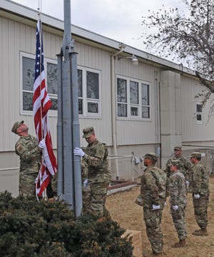 The American flag was raised on the flag pole by the Army's 235th Regiment during the Veterans Day celebration on Monday morning. [AARON ANDERS/SALINA JOURNAL]