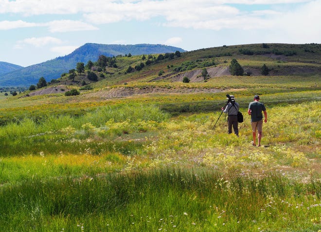 Birding guide Eric Hynes and Tom Watkinson of Telluride walk around Miramonte Reservoir during a birding excursion in August. [Contributed by Pam LeBlanc]