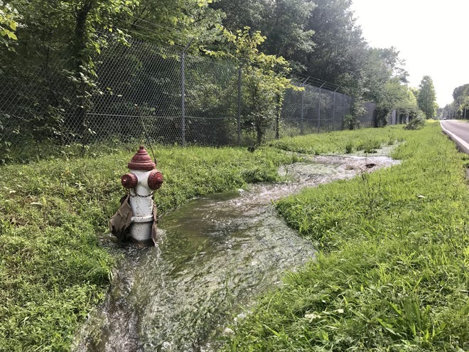 Water flows off the former NAS-JRB Willow Grove property on July 12. Recent testing shows high levels of unregulated PFAS chemicals continue to appear in off-base waterways such as Park Creek and the Little Neshaminy Creek. [KYLE BAGENSTOSE / STAFF]