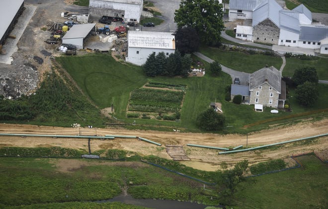 In this July 5, 2017, file photo, pipes for the Sunoco Mariner East pipeline are placed in South Lebanon Township. The FBI is investigating how Gov. Tom Wolf’s administration came to issue permits for construction on a multibillion-dollar pipeline to carry natural gas liquids across Pennsylvania. [JEREMY LONG / LEBANON DAILY NEWS VIA AP]