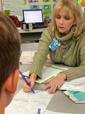 Donna Barton teaches math and science to third graders at Destin Elementary School. She was recently selected by the faculty as Teacher of the Year. [TINA HARBUCK/THE LOG]