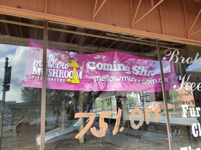 A banner in the window of the building at 2 SW Fort King St. announces the future tenant. However, extensive work needed to the structure means the restaurant could take a year to open. [Carlos E. Medina/Ocala Star-Banner]