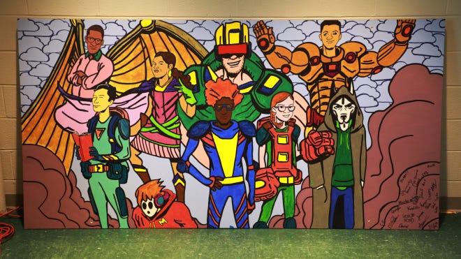 A new mural depicting teens as superheroes is on display at the Turner Free Library in Randolph. (Melissa Bennett)