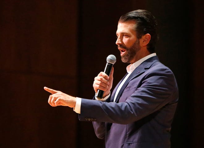 Donald Trump, Jr., gestures as he speaks at the University of Florida, as part of the ACCENT Speakers Bureau speeches, at the University Auditorium on the UF campus in Gainesville, Fla. October 10, 2019. ACCENT used $50,000 of student fee monies to pay for Donald Trump, Jr., and Kimberly Guilfoyle, who was a senior adviser on the Trump presidential campaign, to come and speak. Hundreds of people gathered outside the auditorium to protest Trump and the use of student fee to pay for his speech.  [Brad McClenny/The Gainesville Sun]