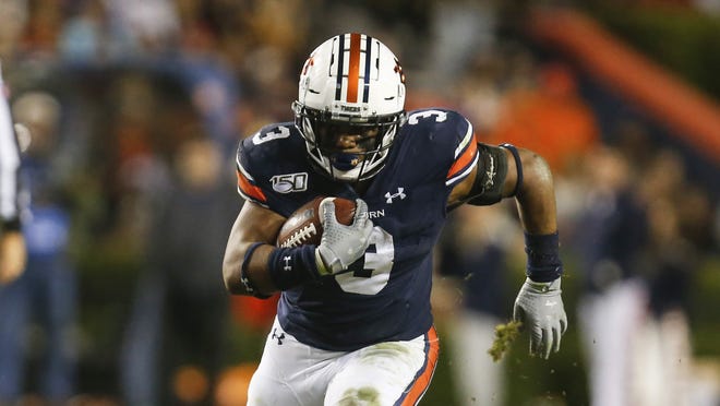 Auburn running back D.J. Williams has gained 223 yards in his last two games for the Tigers. Auburn is in the mix for the TaxSlayer Gator Bowl on Jan. 2 at TIAA Bank Field. [Butch Dill/AP]