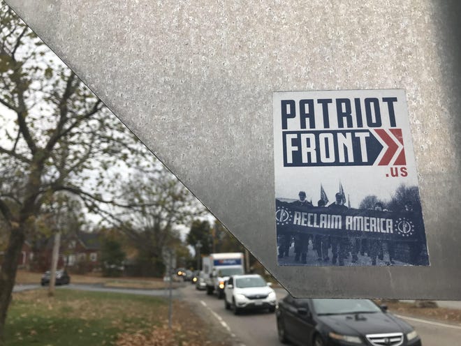 Promotional stickers from a white nationalist group have been placed on street signs and utility poles in Middleboro and West Bridgewater last week. [Enterprise photo]