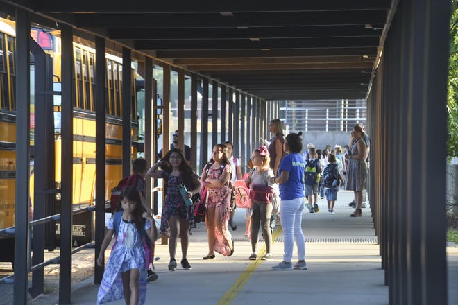 Students get off the busses for the first day of school at Holley-Navarre Intermediate School in 2018. [FILE PHOTO/DAILY NEWS]