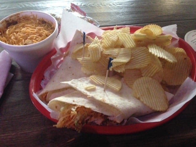 The Buffalo chicken wrap with chips and "Ray Ray's Chili with a Kick" topped with onions and cheese at The Curve Inn. [Elaine Spencer photo]