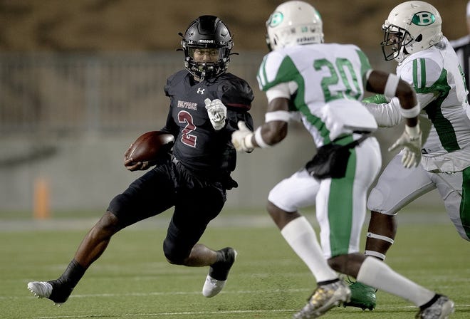 Weiss quarterback Tavian Cord, running against Brenham last week, helped the Wolves go from 0-10 in 2018 to 8-2 this year. Their first playoff game will be against Lockhart on Friday night at the Pfield in Pflugerville. [NICK WAGNER/AMERICAN-STATESMAN]