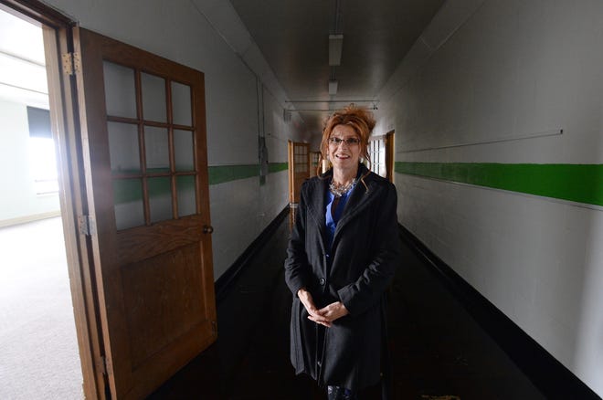 Jennie Hagerty, executive director of the Mercy Center, is shown Nov. 13, 2019,  inside the former Holy Rosary School in Erie. The Mercy Center has an agreement to purchase the building, which will be turned into apartments for families in need.