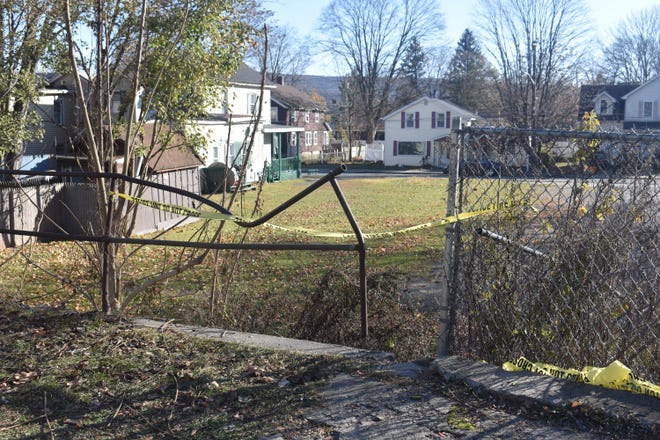 Port Jervis City Police said the body of a newborn baby was found Tuesday evening in a vacant lot of a walking path on Orange Street, near the intersection of Hornbeck Avenue. Police tape can be seen near where the baby was found. [Photo by Rachel Ettlinger/Times Herald-Record]