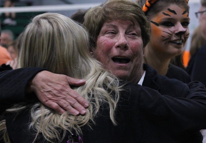Retiring 28-year coach Nancy Meyer, shown celebrating with fans after the sectional finals at Wethersfield High School, led Illini Bluffs past the sectional round for the first time. Her teams is in the Class 1A state semifinals. [Troy E. Taylor]