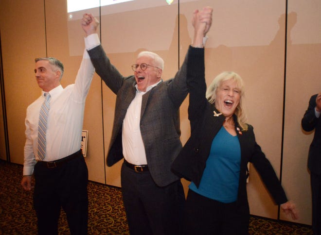 From left, Bob Harvie, Democratic County Chairman John Cordisco and Diane Marseglia celebrate their winning of the county commissioner seat during an Election Day event at Maggio's in Upper Southampton. [WILLIAM THOMAS CAIN / PHOTOJOURNALIST]