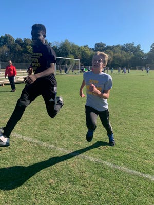 Two students participating in the 2019 Fun Run Fundraiser held on Oct. 16 at Cramerton Christian Academy. [PROVIDED PHOTO]