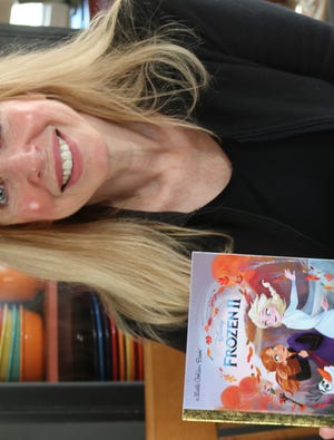 PHOTOS BY GEORGE AUSTIN/THE SPECTATOR/SCMG Somerset children's book author Nancy Cote is pictured above with her new book, Frozen II, which is an adaptation of the movie.