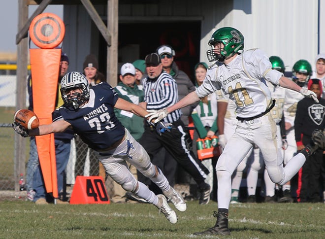 Jaxon Cusac-McKay of Fieldcrest reaches to make a one-hand catch during the Knights' Class 2A playoff win over Elgin St. Edward last week. Fieldcrest will host Clifton Central in a quarterfinal on Saturday. [Photo courtesy of TnT Images]
