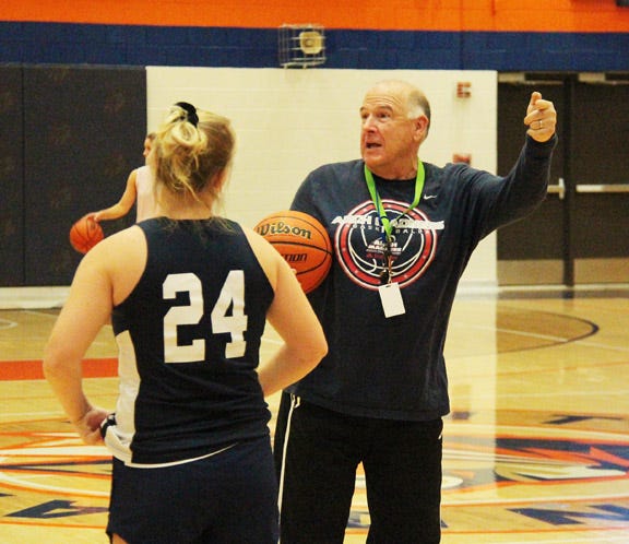 First-year Pontiac girls' coach Brad Harmon makes a point during practice Friday.