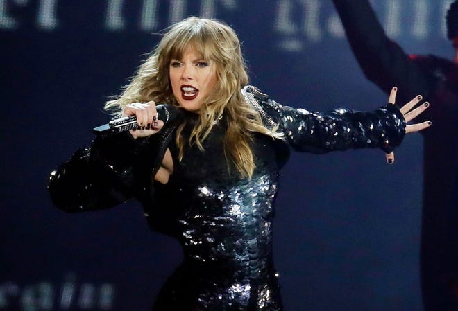 This May 8, 2018 file photo shows Taylor Swift performing during her "Reputation Stadium Tour" opener in Glendale, Ariz. Swift says she may not be performing at the American Music Awards because the men who own her old recordings won’t allow her to play her songs.
