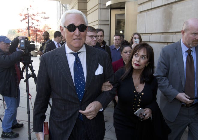 Roger Stone and his wife, Nydia Stone, leave federal court in Washington, D.C., on Friday. [AP Photo/Jose Luis Magana]