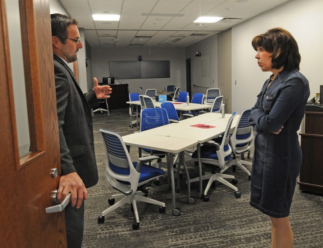 Scott Owings, associate dean of clinical experiences and Office of Rural Medical Education for the University of Kansas School of Medicine-Salina, shows Anne Hazlett, senior adviser for rural affairs for the executive office of the president for the Office of National Drug Control Policy, what one of the classrooms looks like inside the University of Kansas School of Medicine in Salina on Friday. [AARON ANDERS/SALINA JOURNAL]