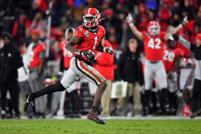 Georgia wide receiver George Pickens runs for a touchdown which was called back due to a penalty during the second half of an NCAA college football game against Missouri, Saturday, Nov. 9, 2019, in Athens, Ga. (AP Photo/John Amis)
