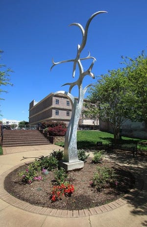The kinetic tree sculpture known as ’Ghillie Dhu’s Enchantment’ has been located within Center City Park in downtown Gastonia since it was commissioned by Keep Gastonia Beautiful in 2010. The sculpture is being moved to Lineberger Park because of the new downtown apartments being built. [Mike Hensdill/The Gaston Gazette]