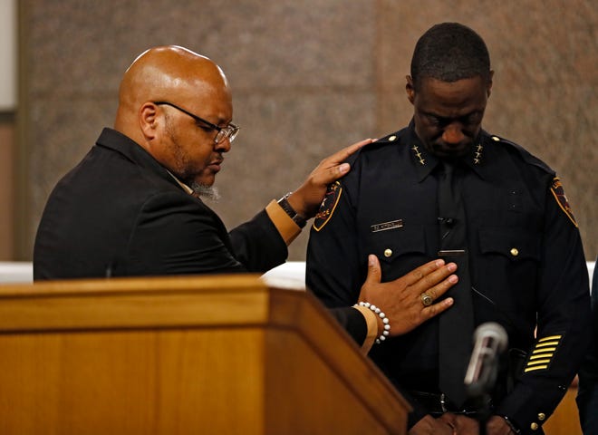 Bill Stubblefield prays over Floyd Mitchell and his family before he is sworn in as Chief of Police, Friday, Nov. 15, 2019, at City Hall in Lubbock, Texas. [Brad Tollefson/A-J Media]