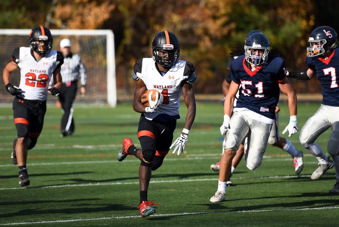 Wayland junior Jaison Tucker, pictured carrying the ball during a game at Myers Field in Sudbury on Oct. 26, 2019, helped the Warriors beat Marblehead in a non-playoff game on Saturday. [Daily News and Wicked Local Staff File Photo/John Walker]