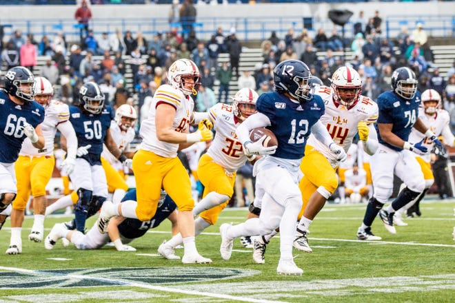 Georgia Southern running back Wesley Kennedy III (12), a Benedictine graduate from Savannah, escapes a pack of ULM defenders for a huge gain Saturday at Paulson Stadium in Statesboro. [HUNTER D. CONE/SAVANNAHNOW.COM]