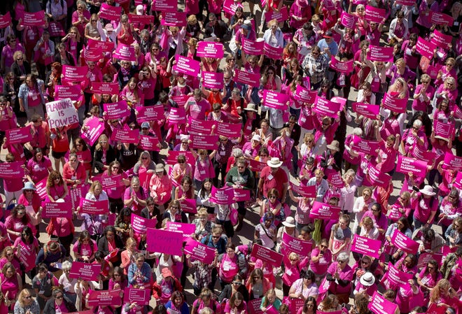Hundreds of people wearing pink participate in the Planned Parenthood rally at the Capitol in 2017. Planned Parenthood gave up about $60 million in Title X funding, which a network of eight Christian pregnancy centers in Texas is now jockeying for as it makes plans to take the unprecedented step of offering unmarried women contraceptives next year. [JAY JANNER / AMERICAN-STATESMAN]