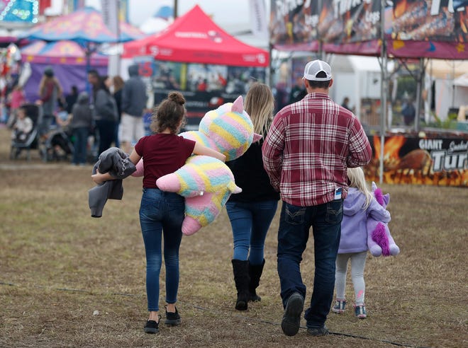 Fair goers ride the amusement rides at the Volusia County Fair in DeLand, Saturday Nov. 16, 2019. [News-Journal/Nigel Cook]