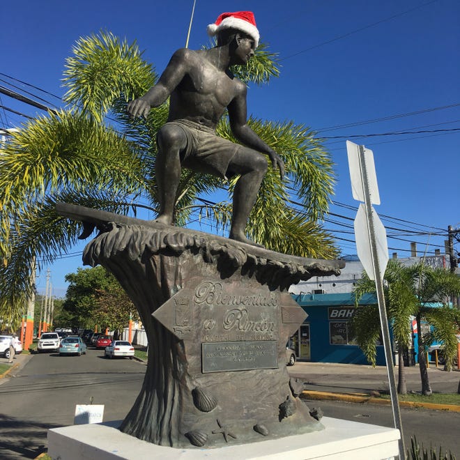 A large bronze statue of a surfer in the center of town welcomes visitors and pays tribute to Rincón, Puerto Rico, as the capital of surfing. [TNS file]