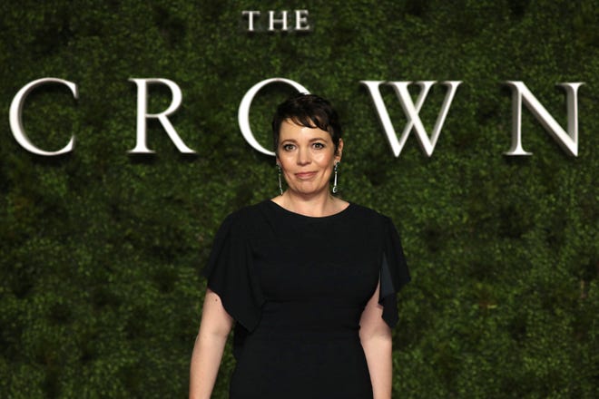 Actress Olivia Colman poses for photographers upon arrival at the world premiere of 'The Crown' season 3 on Wednesday in Central London. [Vianney Le Caer/Invision/AP]