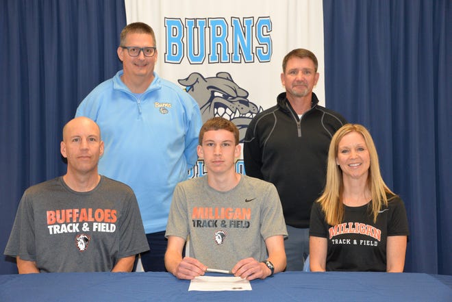 Kenneth and Melanie Walker joined their son Ausitn on Wednesday as he committed to run track and cross country at Milligan college.
