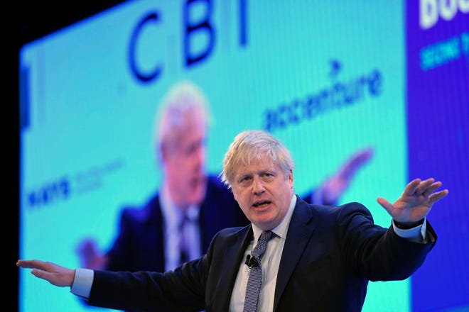 Britain's Prime Minister Boris Johnson speaks at the Confederation of British Industry annual conference in London on Monday. Britain's Brexit is one of the main issues for political parties and for voters, as the UK goes to the polls in a General Election on Dec. 12. [STEFAN ROUSSEAU/THE ASSOCIATED PRESS]