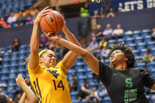 West Virginia sophomore foward Kari Niblack battles for a rebound on Oct. 29 during the Mountaineers preseason game against Salem. Niblack, a former Wildwood standout, is second on the team in scoring and rebounding. [COURTESY / WEST VIRGINIA ATHLETIC COMMUNICATIONS]
