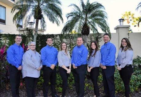 Agency owner Billy Wagner (center right) is joined by his team of agents at Ponte Vedra Beach.