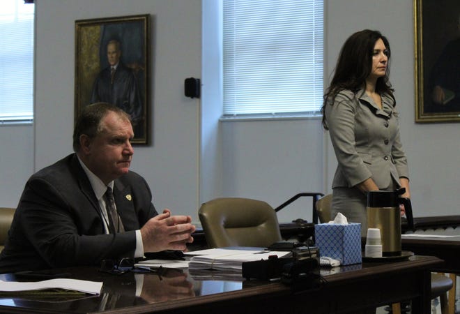 Acting Warren County First Assistant Prosecutor Michael McDonald listens as attorney, Carrolyn Fiorino, who represents Todd Warner, speaks to Warren County Superior Court Judge H. Matthew Curry in Belvidere on Tuesday. [Photo by Lori Comstock/New Jersey Herald]