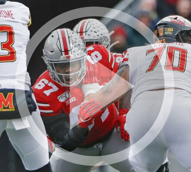 In this file photo Ohio State Buckeyes defensive lineman Robert Landers (67) moves toward Maryland Terrapins quarterback Tyrrell Pigrome (3) during the second quarter of a NCAA Division I college football game between the Ohio State Buckeyes and the Maryland Terrapins on Saturday, November 9, 2019 at Ohio Stadium in Columbus, Ohio.